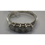A FOUR STONE DIAMOND RING, ON A 9CT WHITE GOLD SHANK, RING SIZE K