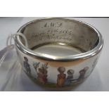 A VICTORIAN SILVER BANGLE, decorated with detailed enamel work of children planting trees, inscribed