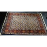 A CREAM GROUND PERSIAN RUG with allover floral decoration, 105cm wide x 155cm long (plus fringes)