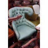 A VICTORIAN UPHOLSTERED CHAIR with an unusual shaped buttoned back on cabriole legs