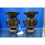 A PAIR OF JAPANESE PATINATED BRONZE VASES, with elephant head handles 14cm high