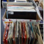 A COLLECTION OF 45s in a 1960s stand and a collection of LP records