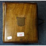 A 19TH CENTURY WOODEN COVERED PHOTOGRAPH ALBUM, containing family portraits, once belonging to Mr