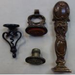 A 19TH CENTURY STEEL SEAL with fold out corkscrew and others similar