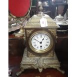 A VICTORIAN CAST BRASS CASED SINGLE TRAIN MANTEL CLOCK with enamel dial
