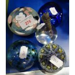 A GLASS PAPERWEIGHT DECORATED WITH A COLD PAINTED METAL CAT and a collection of glass paperweights