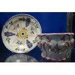 A CONTINENTAL TIN GLAZED 'PANCAKE BOTTOM' PLATE, 22.5cm dia. and a Ste Clement bough pot (2)