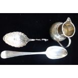 18TH CENTURY HANOVERIAN PATTERN SPOON, continental embossed silver spoon and a silver cream jug (c.