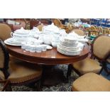 A VICTORIAN MAHOGANY CENTRE TABLE the circular top raised on a central baluster column and