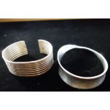 A GEORG JENSEN SILVER BANGLE, of twisted design and other bangle (2)