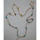 TURQUOISE BEAD AND GOLD NECKLACE, marked 18k