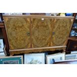 WARING & GILLOW: AN ART DECO FLAMED WALNUT SIDEBOARD, rectangular top with three cupboard doors