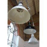 THREE INDUSTRIAL STYLE ENAMEL HANGING LIGHTS, in cream, black and white, each, 42.5cm dia. (some