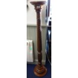 A MAHOGANY TORCHERE with a spiral column