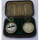 A BRASS CASED BAROMETER and a compass, both in a fitted case
