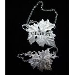 A SILVER DECANTER LABEL, 'CLARET' in the form of an oak leaf and another similar, 'Sherry' (2)