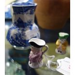 A MINIATURE DERBY TOBY JUG, 4cm high, another similar and a small Mason's ironstone jug (3)