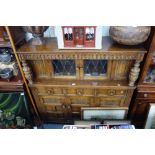 A REPRODUCTION OAK COURT CUPBOARD