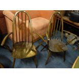 ERCOL; A PAIR OF DARK STAINED STICK BACK ARMCHAIRS