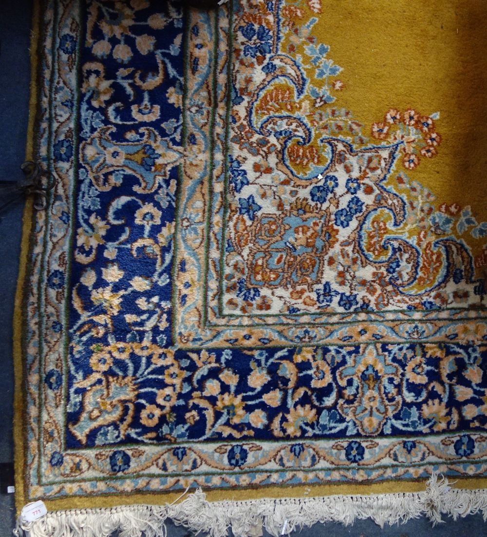 A MUSTARD GROUND ENGLISH CARPET, with a cream and blue floral border, 220cm wide x 310cm long ( - Image 2 of 3