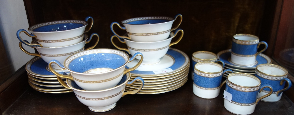 A COLLECTION OF WEDGWOOD BLUE AND GILT EDGED DINNERWARES