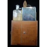 A SILVER PLATED HUNTING FLASK with lunch box, in a fitted leather outer case