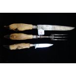 A CARVING KNIFE AND FORK with hoof handles and a similar knife (3)