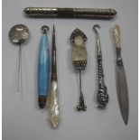 A SILVER BOOK MARK WITH MOTHER OF PEARL HANDLE, with a silver stick pin and other relayed items (a