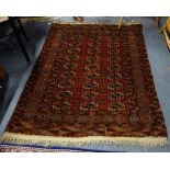 A RED GROUND PERSIAN BOKHARA RUNNER and two similar Persian carpets (3)