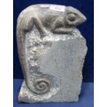 A CARVED LIMESTONE STUDY OF A CHAMELEON, 33cm high