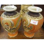 A PAIR OF JAPANESE VASES decorated with warriors