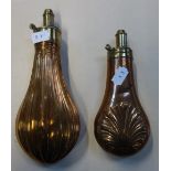 A 19TH CENTURY COPPER POWDER FLASK and another similar (2)