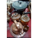 AN ENAMELLED COOKING POT, a collection of copper kettles and other items