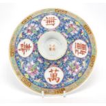 Chinese porcelain footed shallow dish, hand painted in the famille rose palette with flower heads