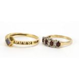 Two 9ct gold rings set with garnet and clear stones, sizes R and J, approximate weight 4.4g : For