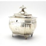 Georgian silver lockable tea caddy, with engraved decoration, raised on four feet, by William