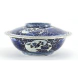 Chinese blue and white porcelain bowl and cover, hand painted and gilded with panels of flowers,