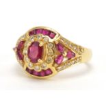 18ct gold ruby and diamond dress ring, housed in a Charles Fox Bournemouth tooled leather box,