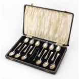 Set of twelve silver teaspoons and sugar tongs, SLD Birmingham 1939, housed in a velvet and silk