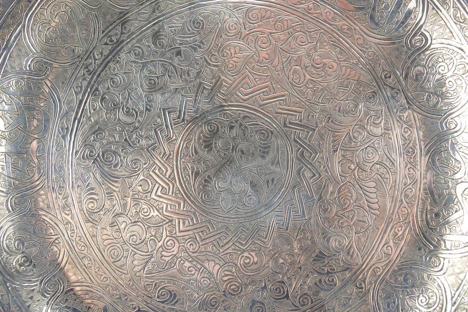 Islamic unmarked silver dish, engraved with script and foliate motifs, 23cm in diameter, approximate - Image 2 of 3