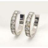 Pair of unmarked white metal diamond hoop earrings, 2.4cm in diameter, approximate weight 8.3g : For