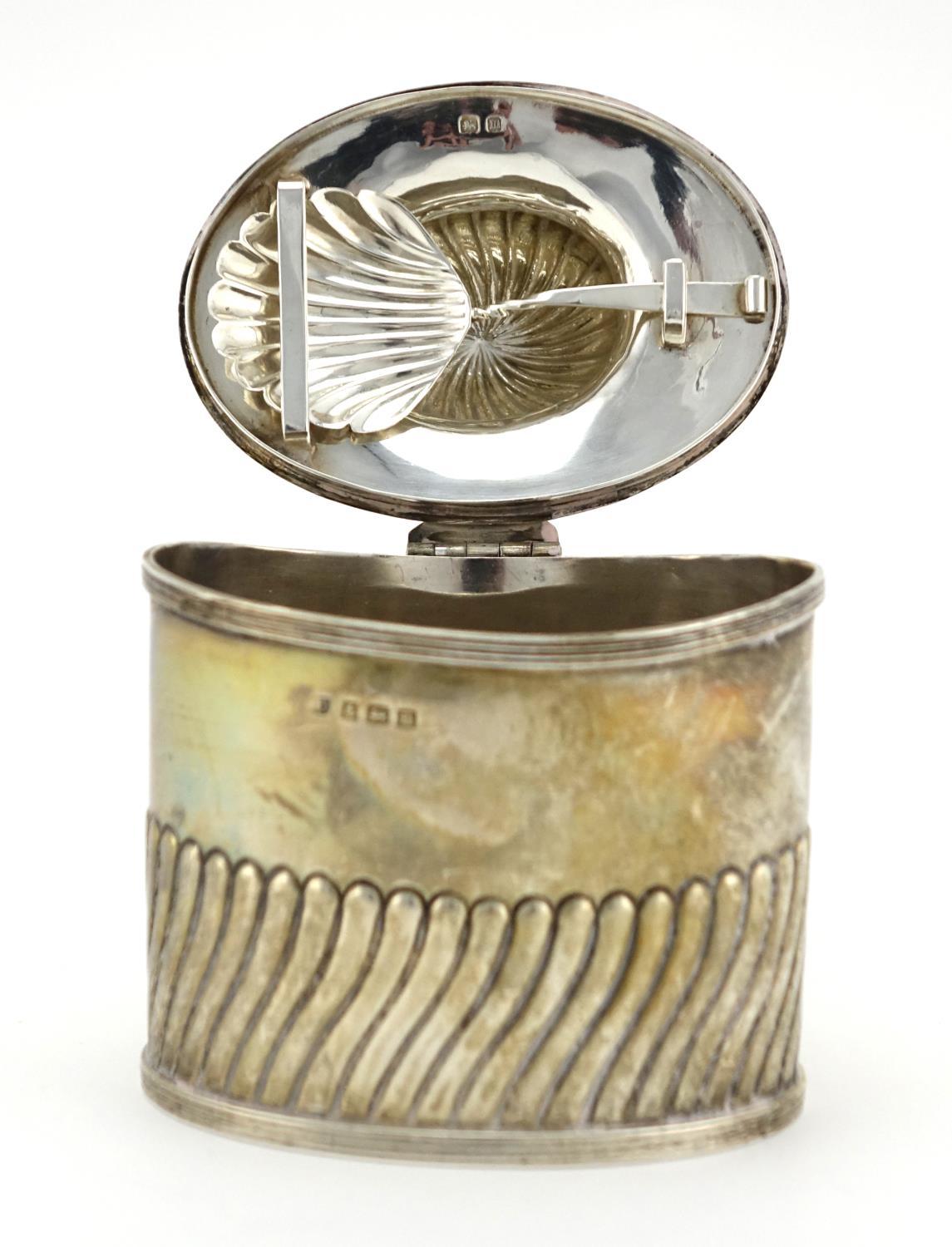 Silver demi fluted tea caddy with fitted spoon to the interior and hinged lid, indistinct makers - Image 3 of 6