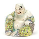 Chinese porcelain figure of seated Buddha wearing a robe, finely hand painted with famille rose