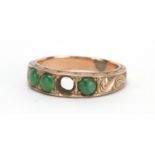 Unmarked gold cabochon jade ring, the band with engraved decoration, size M, approximate weight 3.7g