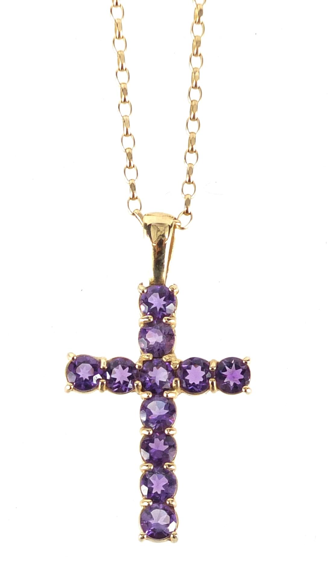 9ct gold amethyst cross pendant on a 9ct gold necklace, the pendant 3.6cm in length, approximate