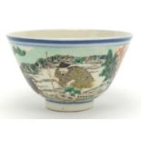 Chinese porcelain footed bowl, hand painted in the famille verte palette with a man being pulled