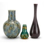 Three art pottery vases comprising a Minton's Secessionist vase No.42 and two Bretby examples,