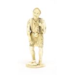 Japanese carved ivory okimono of a workman, incised character marks to the base, 25.5cm high : For