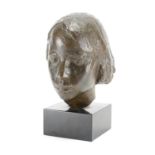 Patinated bronze bust of a young female, raised on a square black slate base, overall 35cm high :