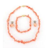 Natural pink coral necklace and bracelet with 9ct gold clasps and a pair of similar earrings,